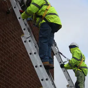 Engineer attached to a safety line and a cow tail